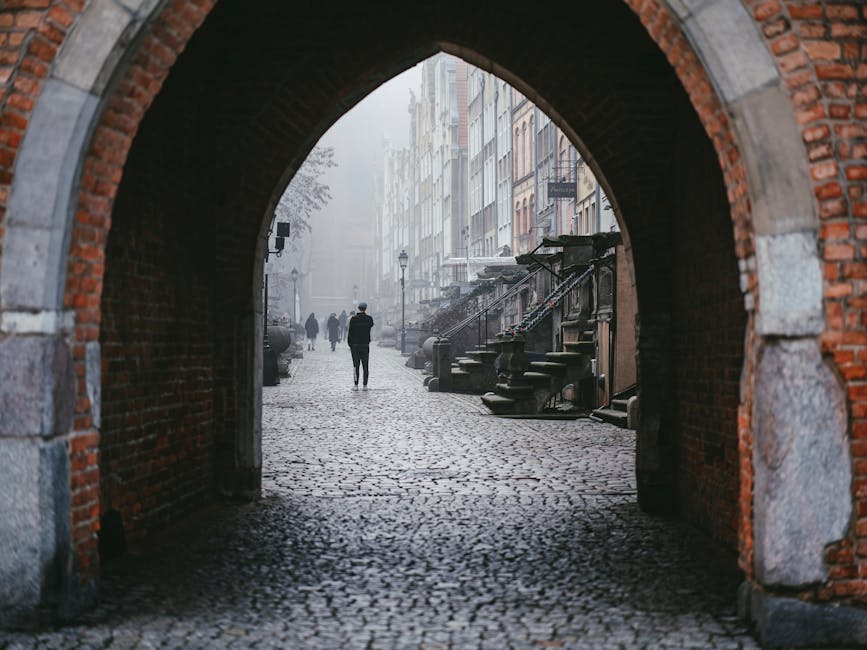 Siena narrow alley cobblestones morning