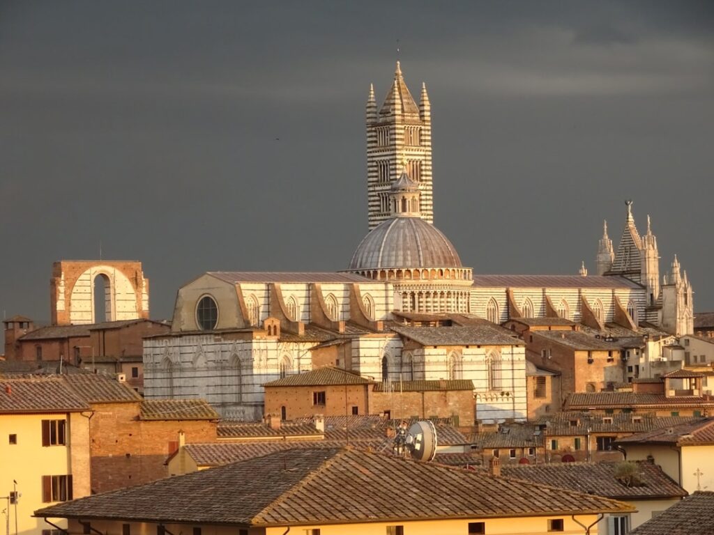 siena sunset rooftops golden hour